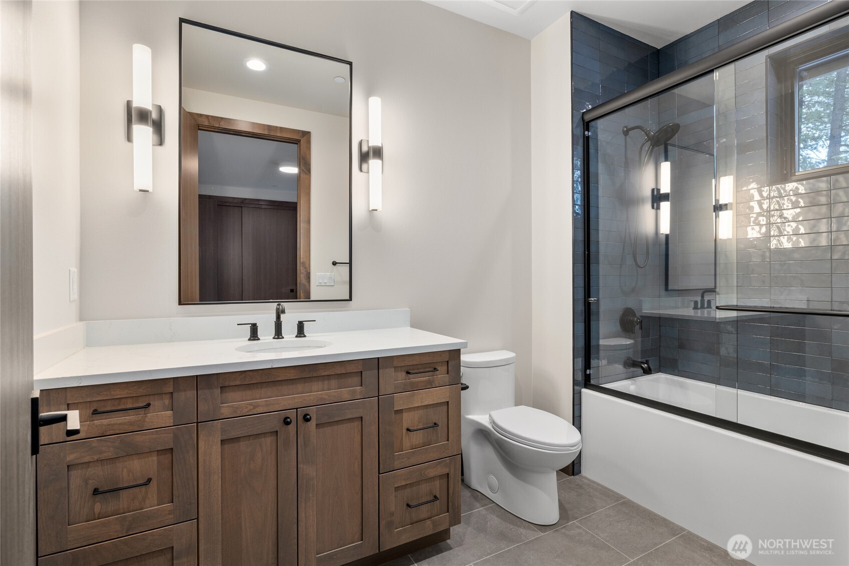 581 Wanawish Loop Cle Elum, WA 98922 - Photo 26 of 40 a bathroom with a toilet a sink and a large mirror