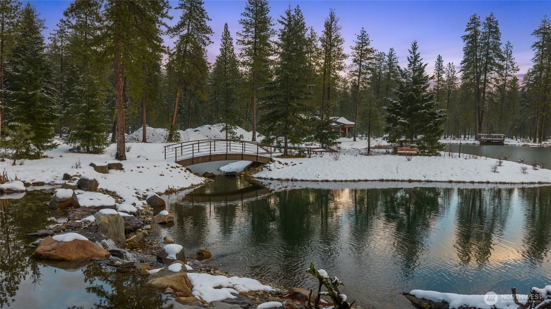 581 Wanawish Loop Cle Elum, WA 98922 - Photo 39 of 40 a view of a lake with trees and houses on th background
