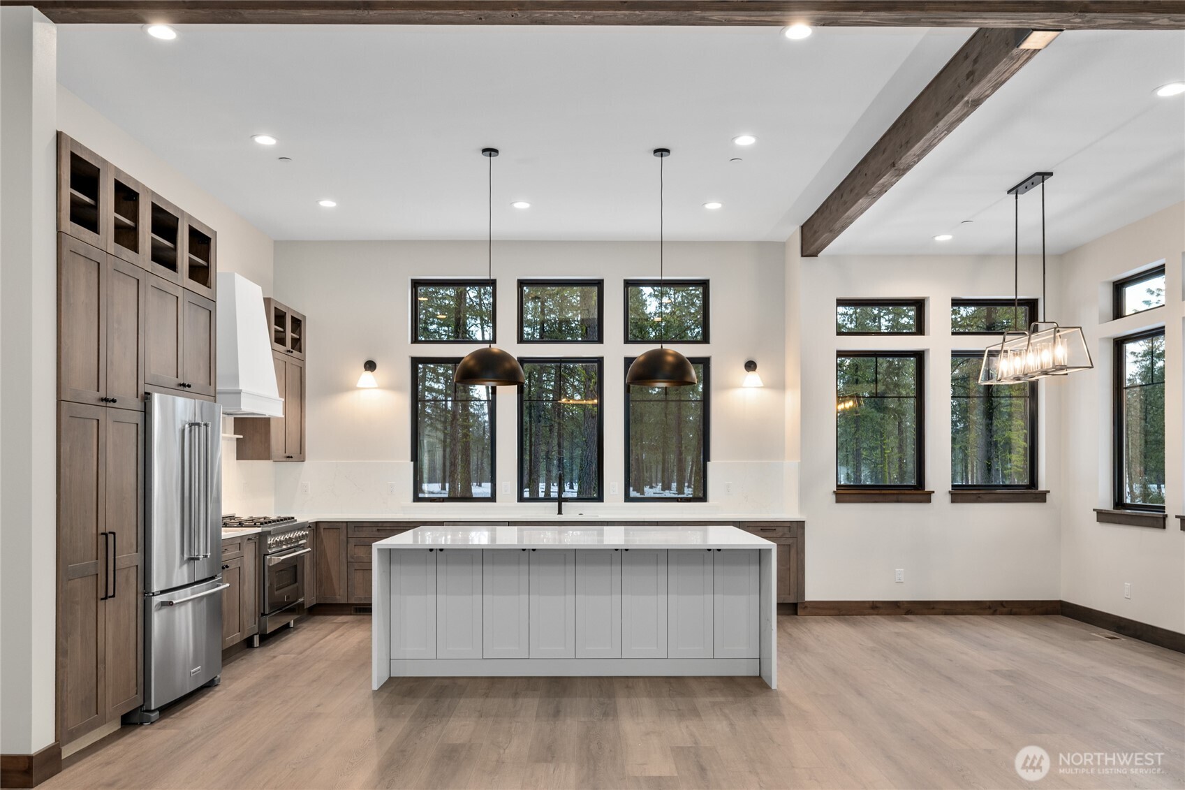 581 Wanawish Loop Cle Elum, WA 98922 - Photo 10 of 40 a kitchen with stainless steel appliances granite countertop a refrigerator a stove and a wooden floors