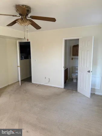 a view of a livingroom with a ceiling fan