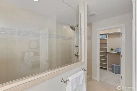 a bathroom with a bathtub and a shower