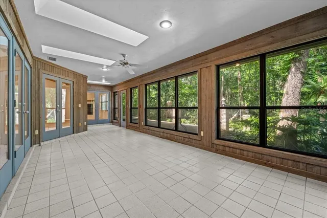 a view of an empty room with windows