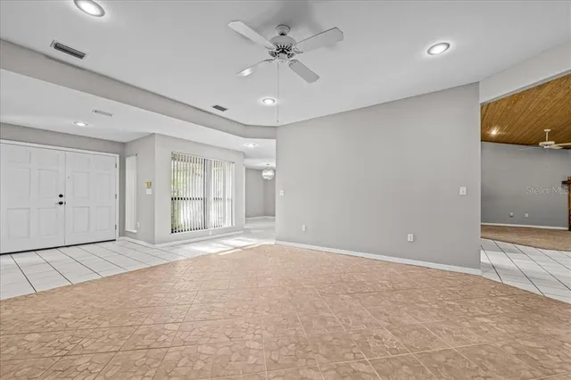 a view of an empty room with a window