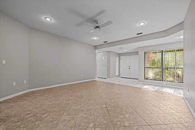 a view of an empty room with a window