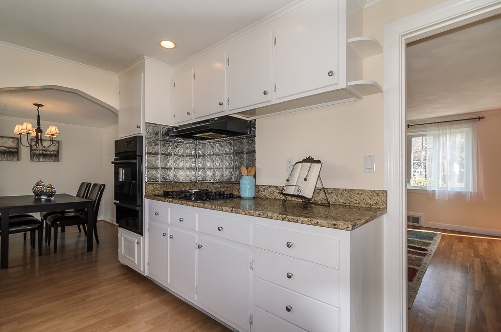 15 Ferndale Road Natick, MA 01760 - Photo 6 of 20 a kitchen with granite countertop white cabinets and white appliances