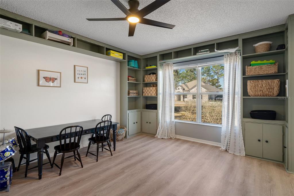 11258 Lomita Wren Road Weeki Wachee, FL 34614 - Photo 8 of 44 a view of a livingroom with furniture window and wooden floor