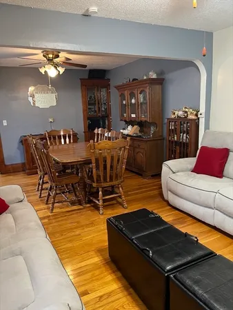 a bedroom with a bed and a television