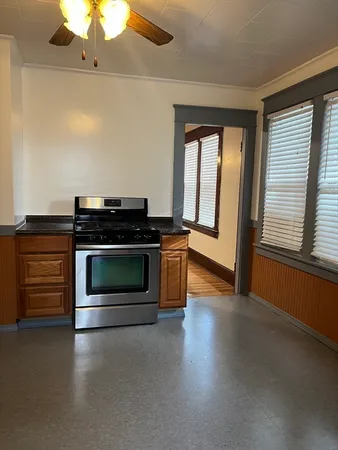 a kitchen with a stove and a microwave