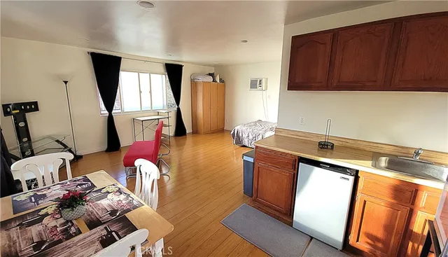 a kitchen with stainless steel appliances granite countertop a stove a refrigerator and a microwave