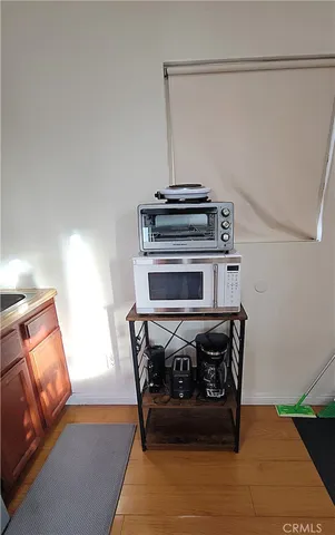 a kitchen with a sink and a stove top oven