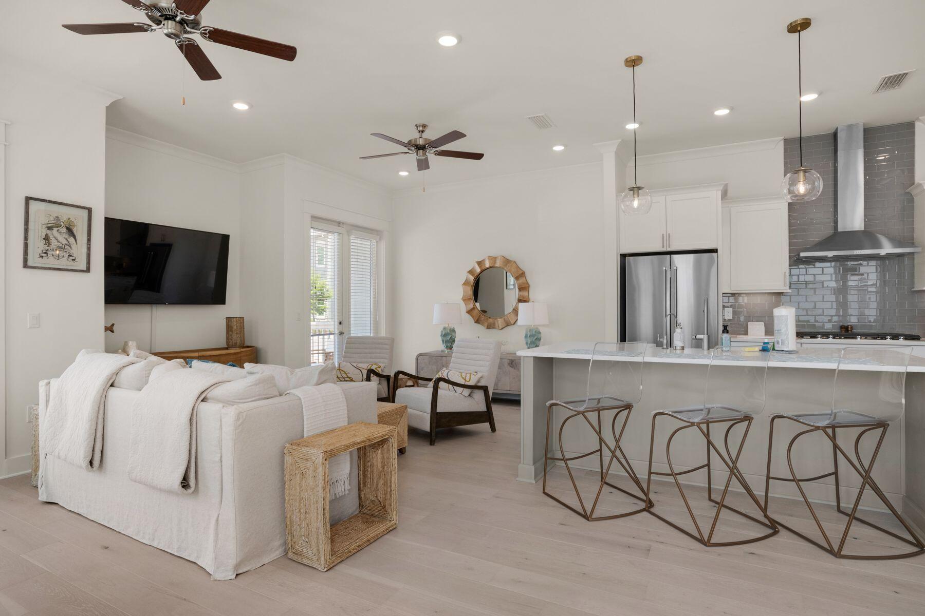 110 Wharf Ln Inlet Beach, Unit A Inlet Beach, FL 32461 - Photo 1 of 27 a living room with furniture and a flat screen tv