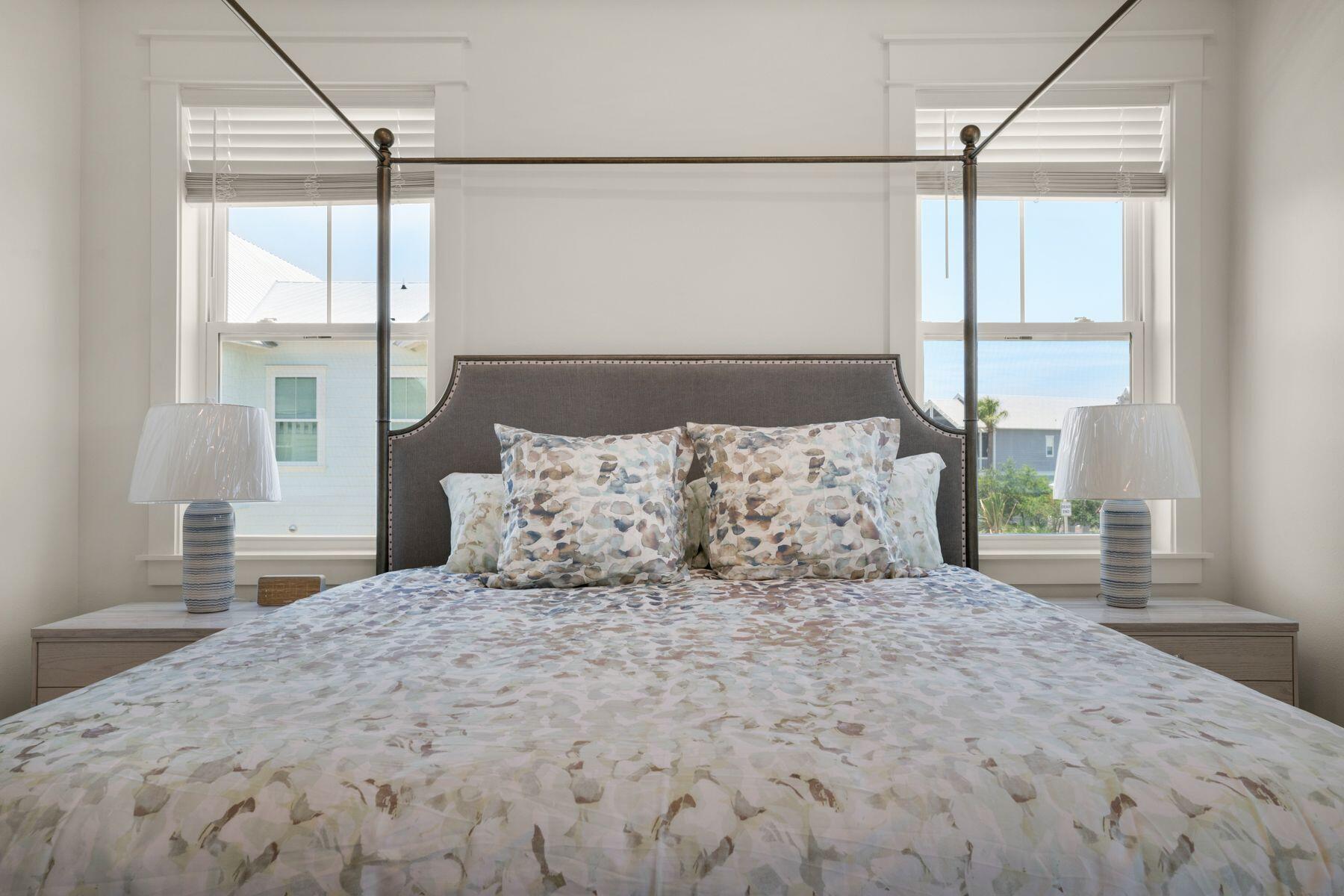 110 Wharf Ln Inlet Beach, Unit A Inlet Beach, FL 32461 - Photo 18 of 27 a large bed sitting in a bedroom next to a window