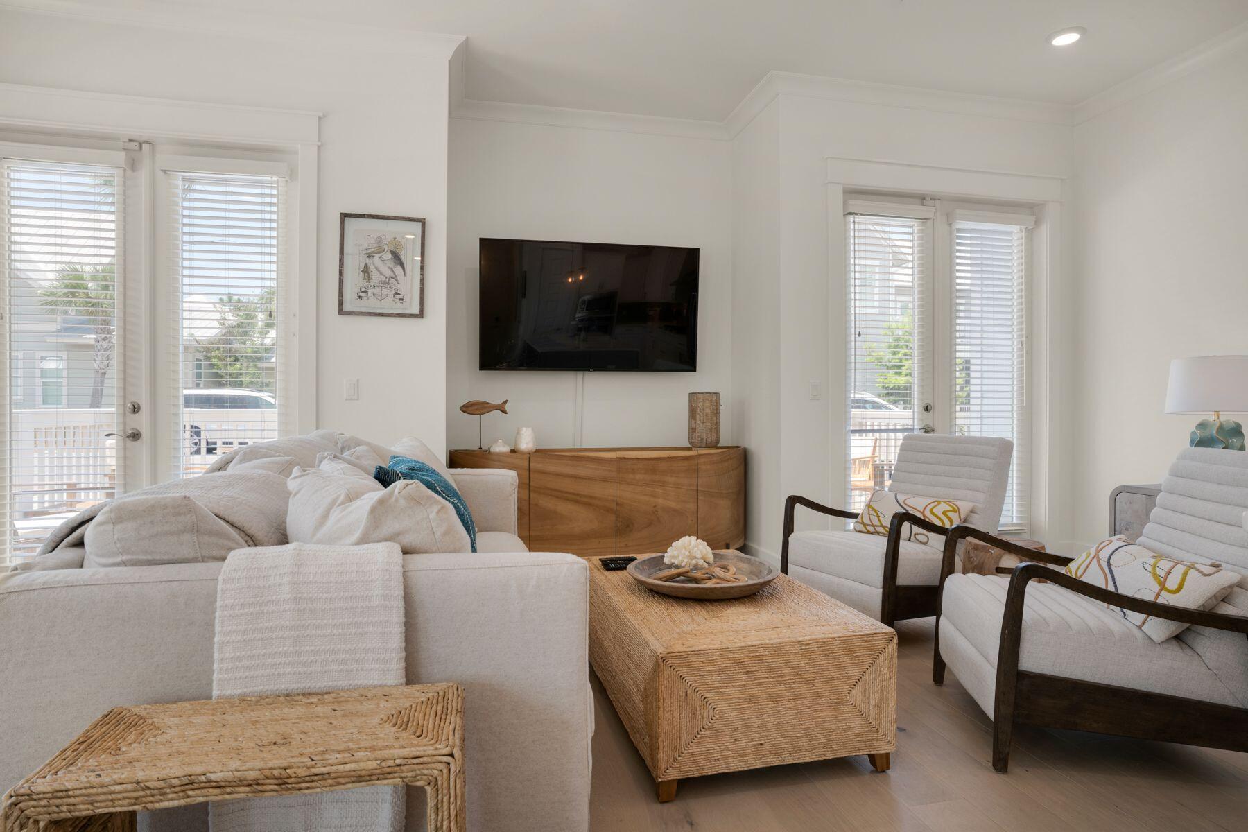 110 Wharf Ln Inlet Beach, Unit A Inlet Beach, FL 32461 - Photo 2 of 27 a living room with furniture and a flat screen tv