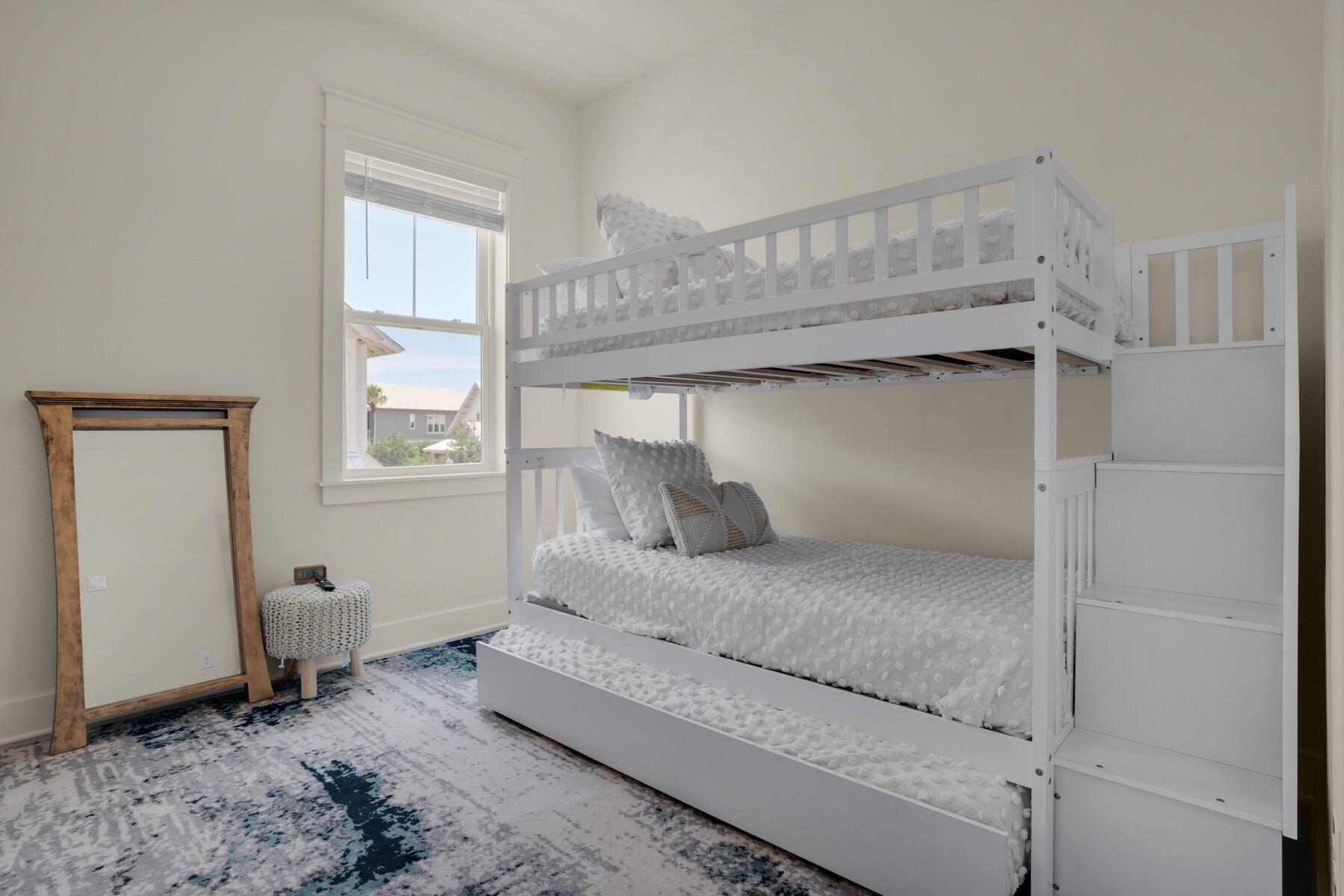 110 Wharf Ln Inlet Beach, Unit A Inlet Beach, FL 32461 - Photo 24 of 27 a bedroom with a bed and a window