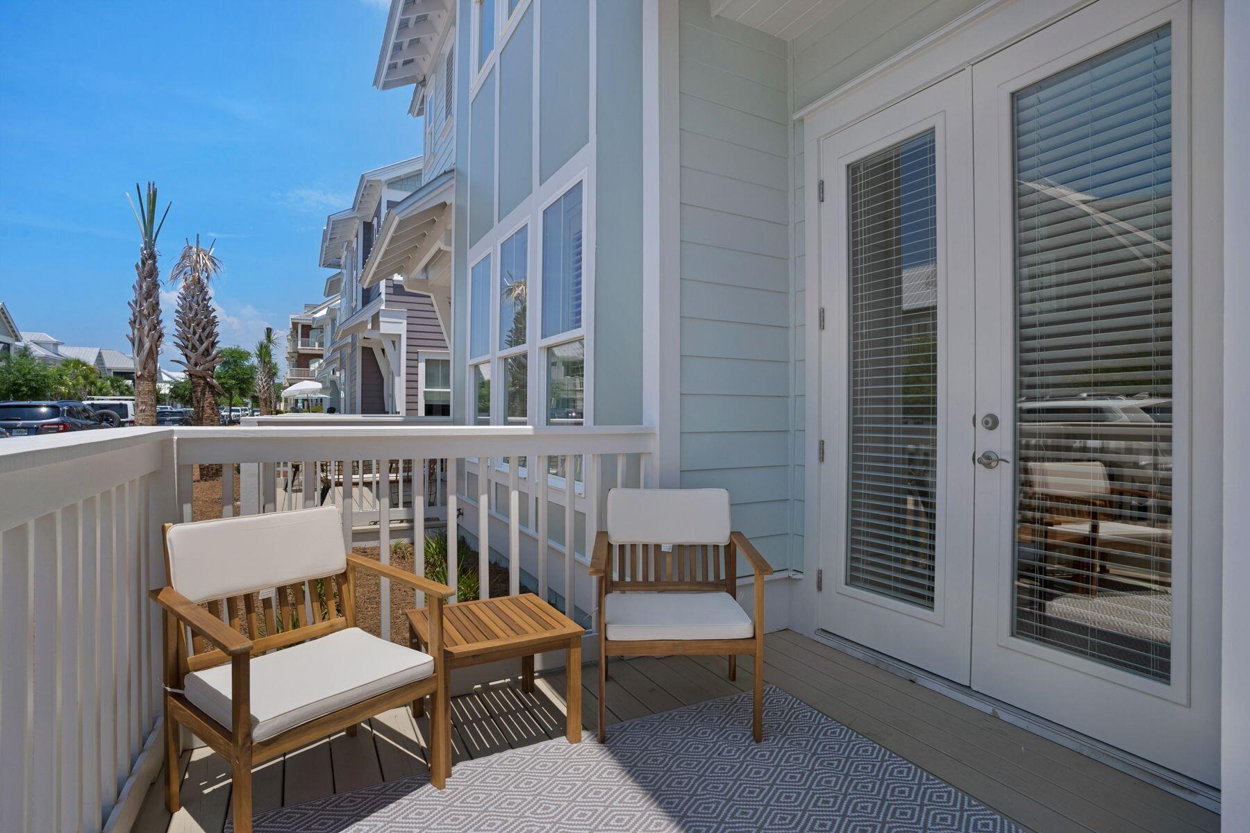 110 Wharf Ln Inlet Beach, Unit A Inlet Beach, FL 32461 - Photo 7 of 27 a view of a chair and table in the balcony