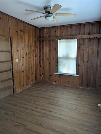 a view of a room with wooden walls