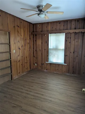 a view of a room with wooden walls