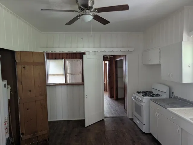 a kitchen with stainless steel appliances a refrigerator and a stove top oven