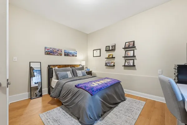 a bedroom with a bed and a couch