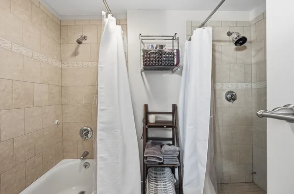 a bathroom with a shower and a toilet