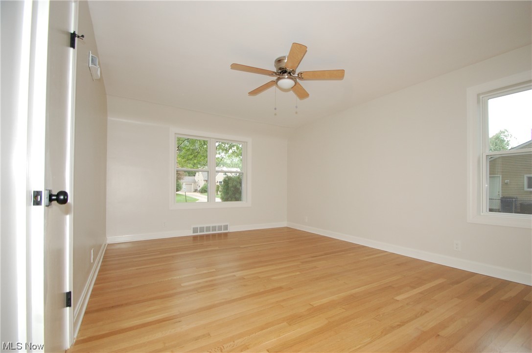 408 Ewing Road Youngstown, OH 44512 - Photo 17 of 31 Unfurnished room featuring light hardwood flooring and ceiling fan