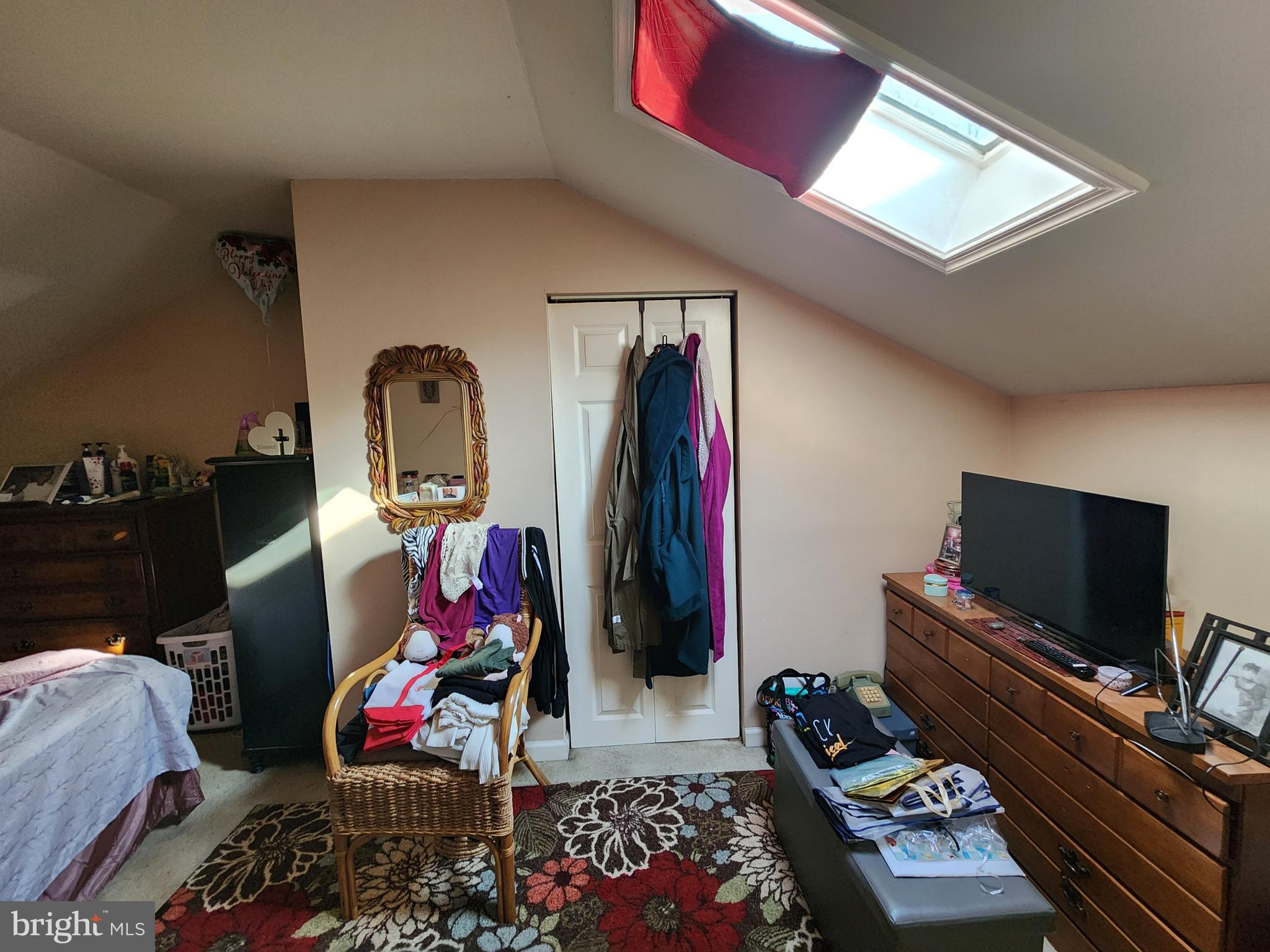 2843 Bookert Drive Baltimore, MD 21225 - Photo 12 of 17 a bedroom with furniture and a flat screen tv