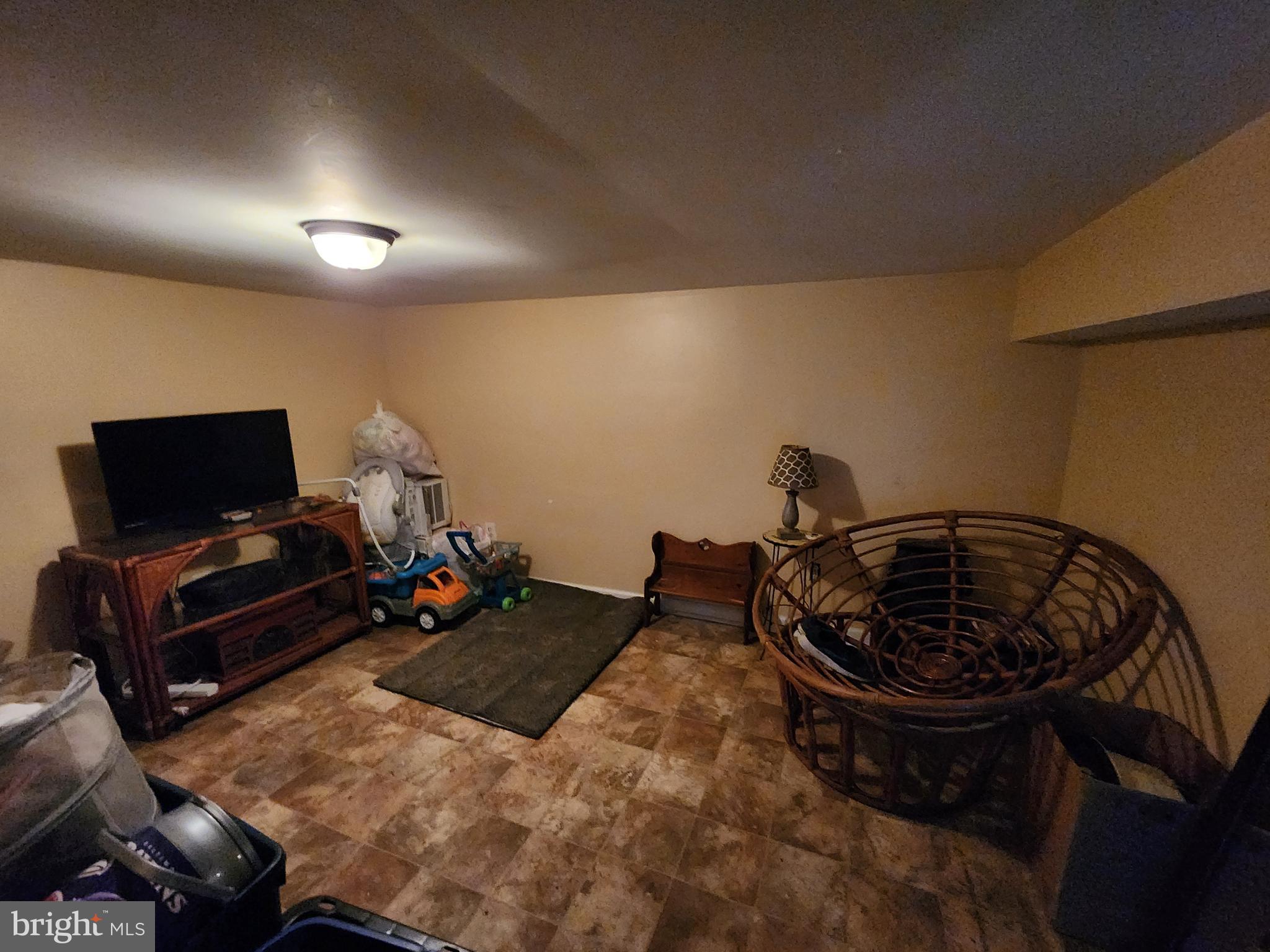 2843 Bookert Drive Baltimore, MD 21225 - Photo 14 of 17 a living room with furniture and a flat screen tv