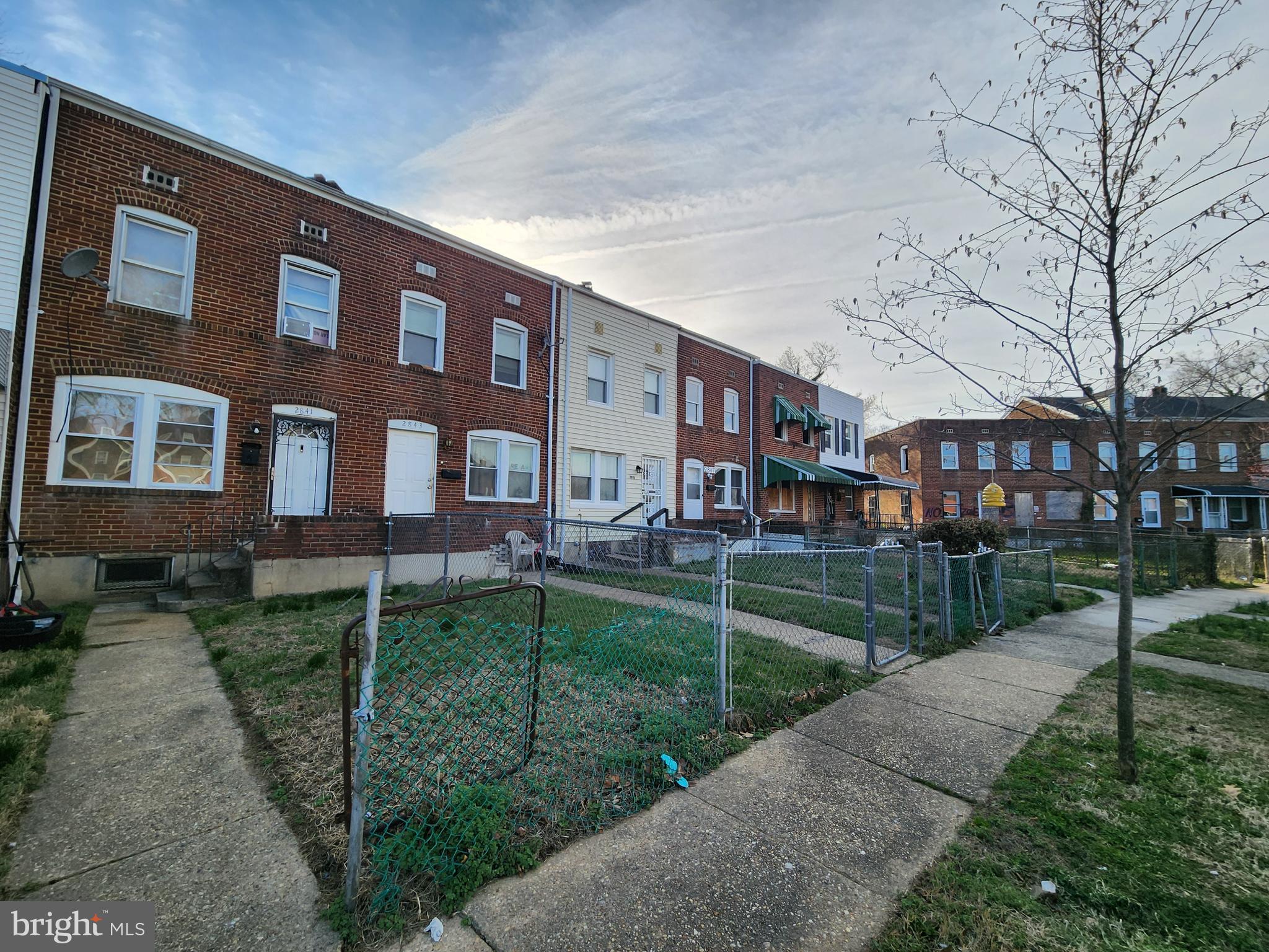 2843 Bookert Drive Baltimore, MD 21225 - Photo 3 of 17 a view of a brick building next to a yard
