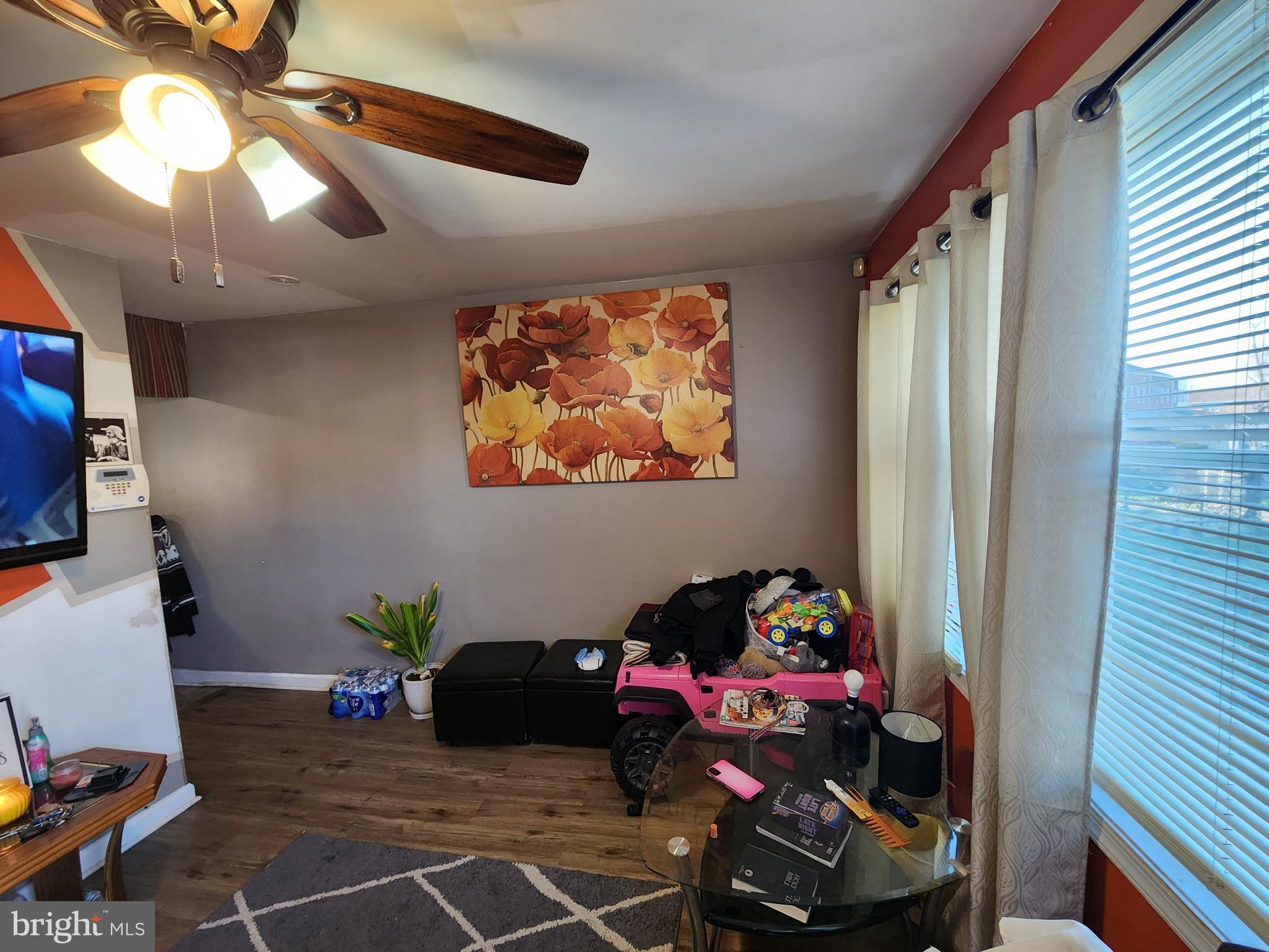 2843 Bookert Drive Baltimore, MD 21225 - Photo 5 of 17 a bedroom with furniture and a window