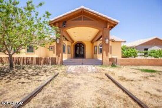 480 Camino Ramanote Rio Rico, AZ 85648 - Photo 5 of 43 Portico on circular drive to grand entrance throug the custom metalwork front entry door.