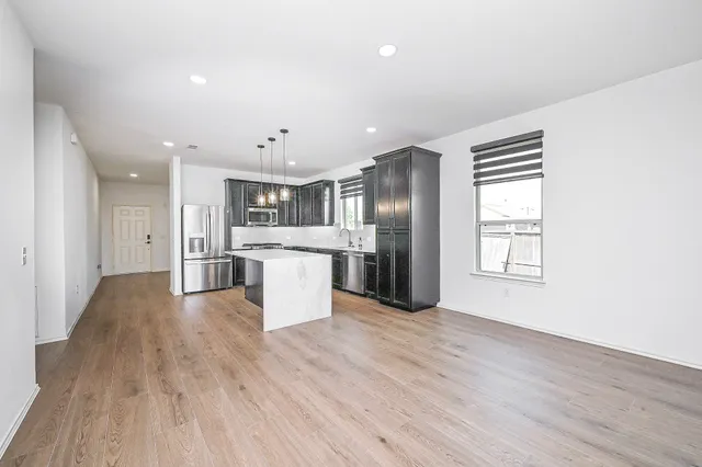 a view of kitchen with wooden floor