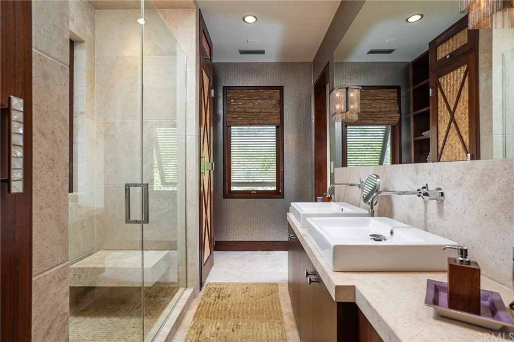 33 Strand Beach Drive Dana Point, CA 92629 - Photo 28 of 54 a bathroom with a tub a sink and glass door