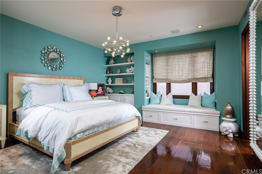 33 Strand Beach Drive Dana Point, CA 92629 - Photo 31 of 54 a spacious bedroom with a bed table chair and a window