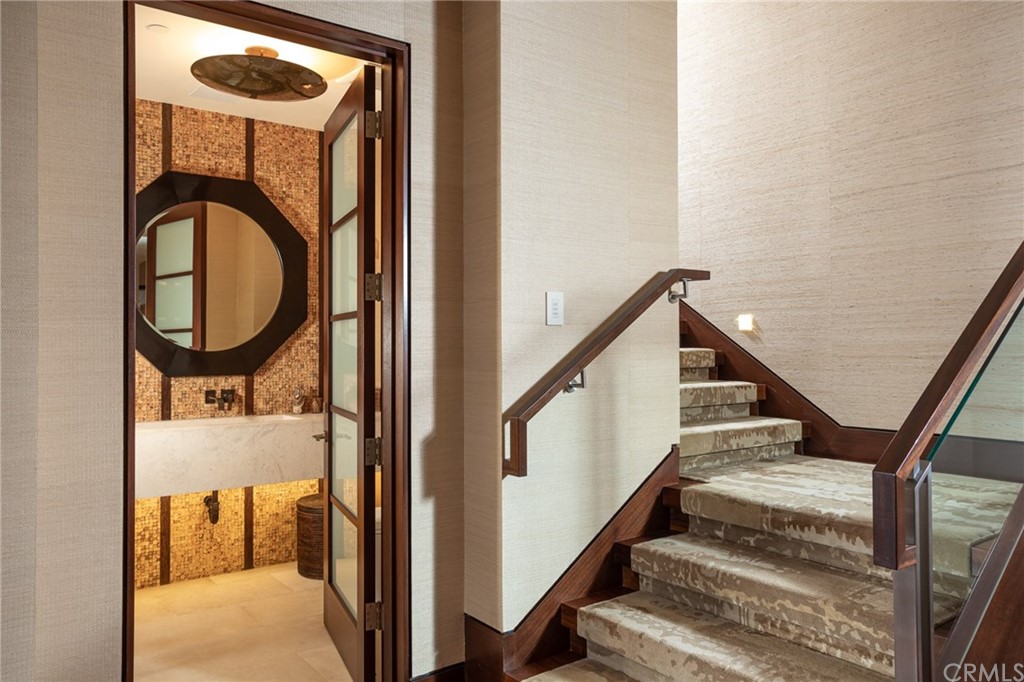 33 Strand Beach Drive Dana Point, CA 92629 - Photo 32 of 54 a view of staircase with white walls and a window