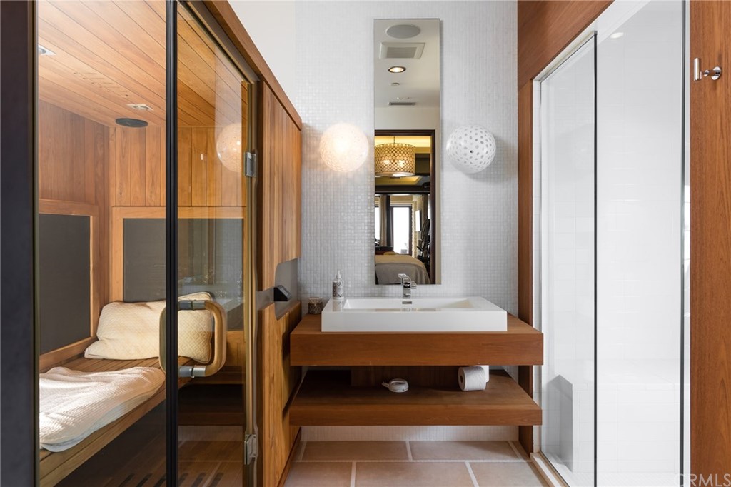 33 Strand Beach Drive Dana Point, CA 92629 - Photo 41 of 54 a en suite bathroom with a sink double vanity and a mirror