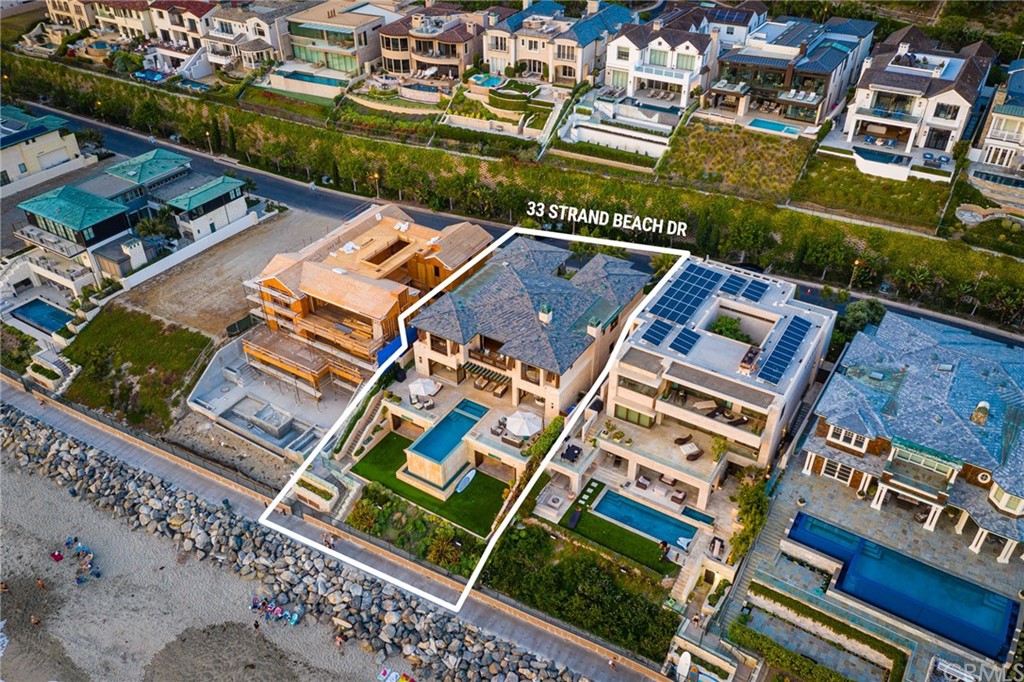 33 Strand Beach Drive Dana Point, CA 92629 - Photo 48 of 54 an aerial view of a residential apartment building with a yard