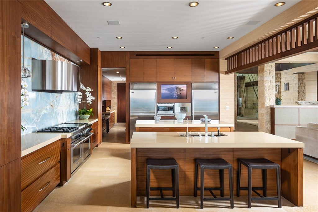 33 Strand Beach Drive Dana Point, CA 92629 - Photo 10 of 54 a large kitchen with granite countertop a stove and cabinets