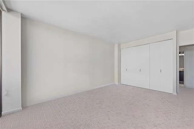 a view of an empty room and entryway