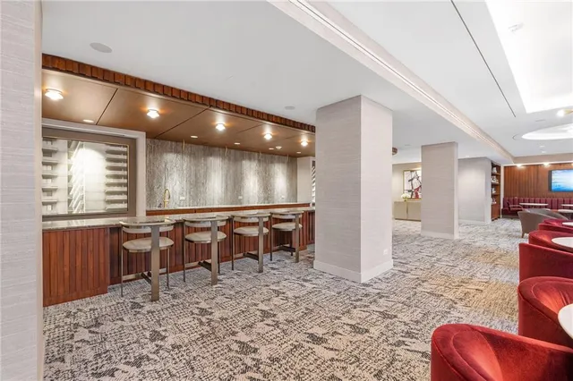 a view of a lobby area with furniture and windows