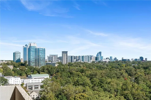 a view of a city with tall buildings in the background