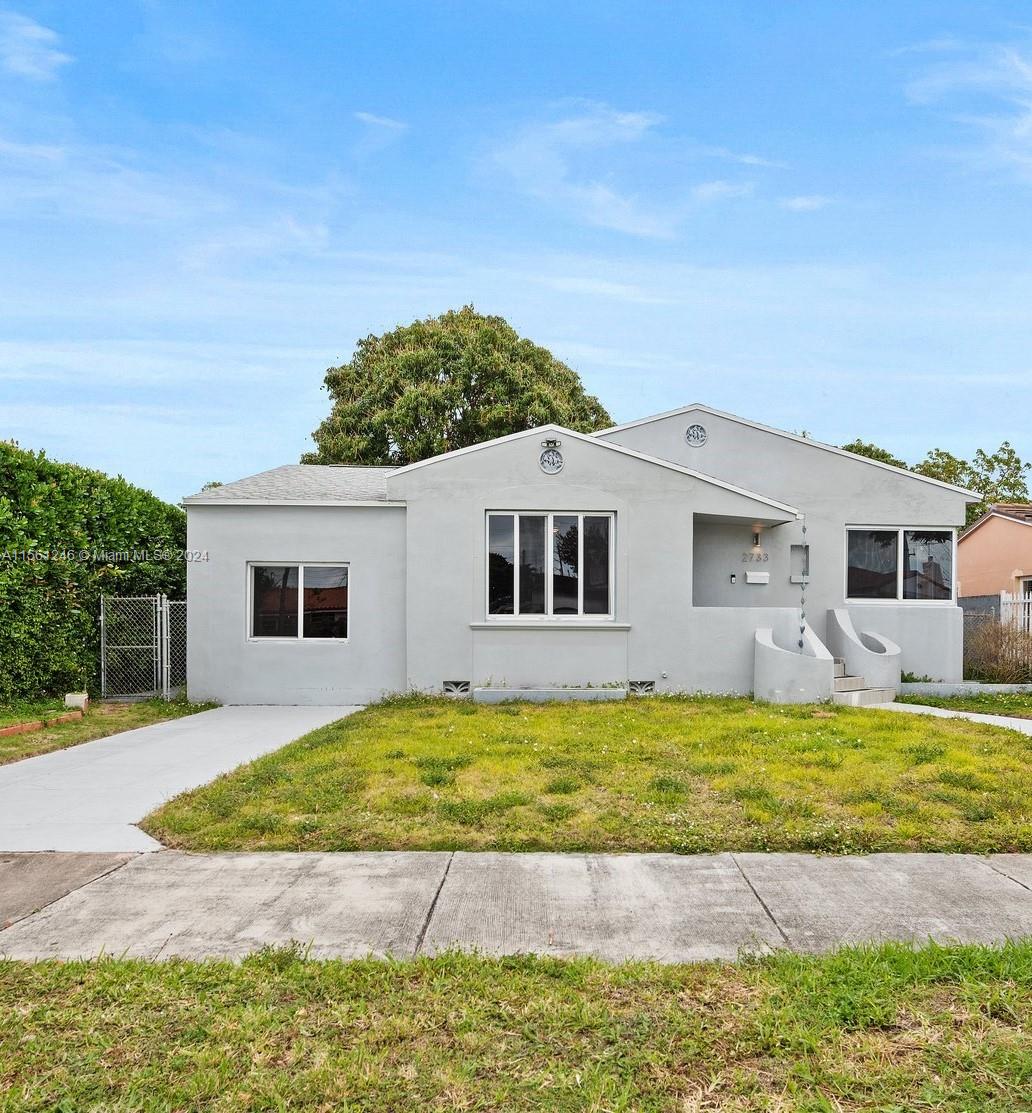 2733 Southwest 15th Street Miami, FL 33145 - Photo 1 of 34 a view of a house with a swimming pool