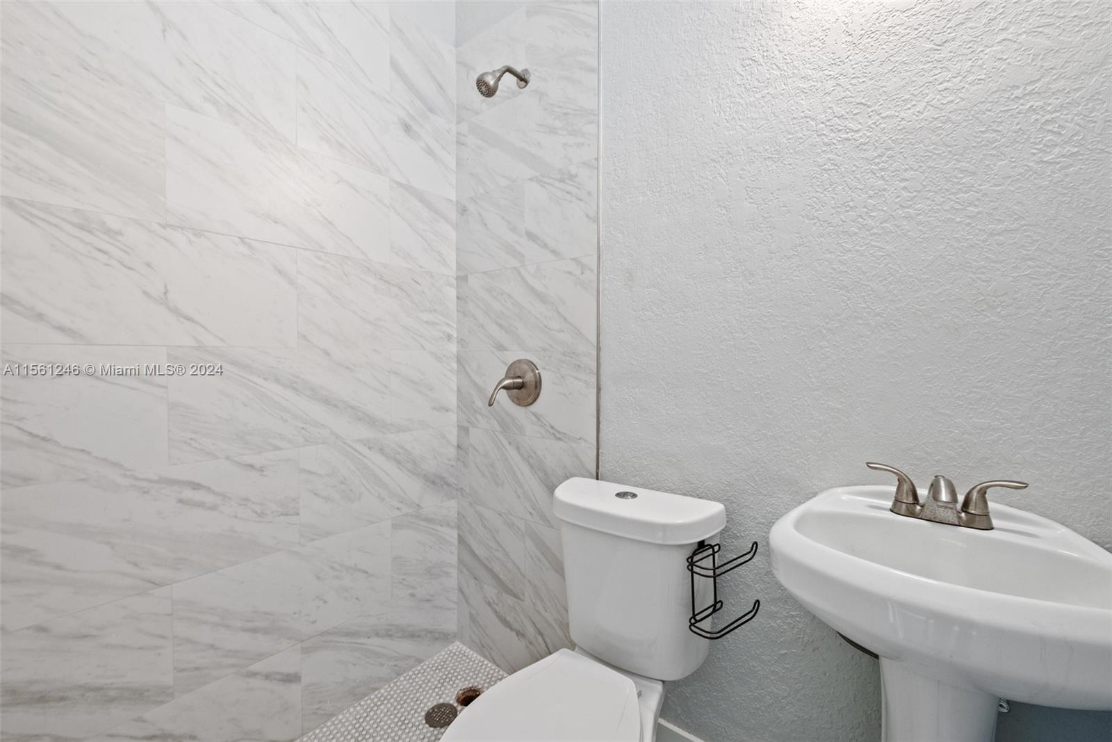 2733 Southwest 15th Street Miami, FL 33145 - Photo 15 of 34 a bathroom with a sink toilet and shower