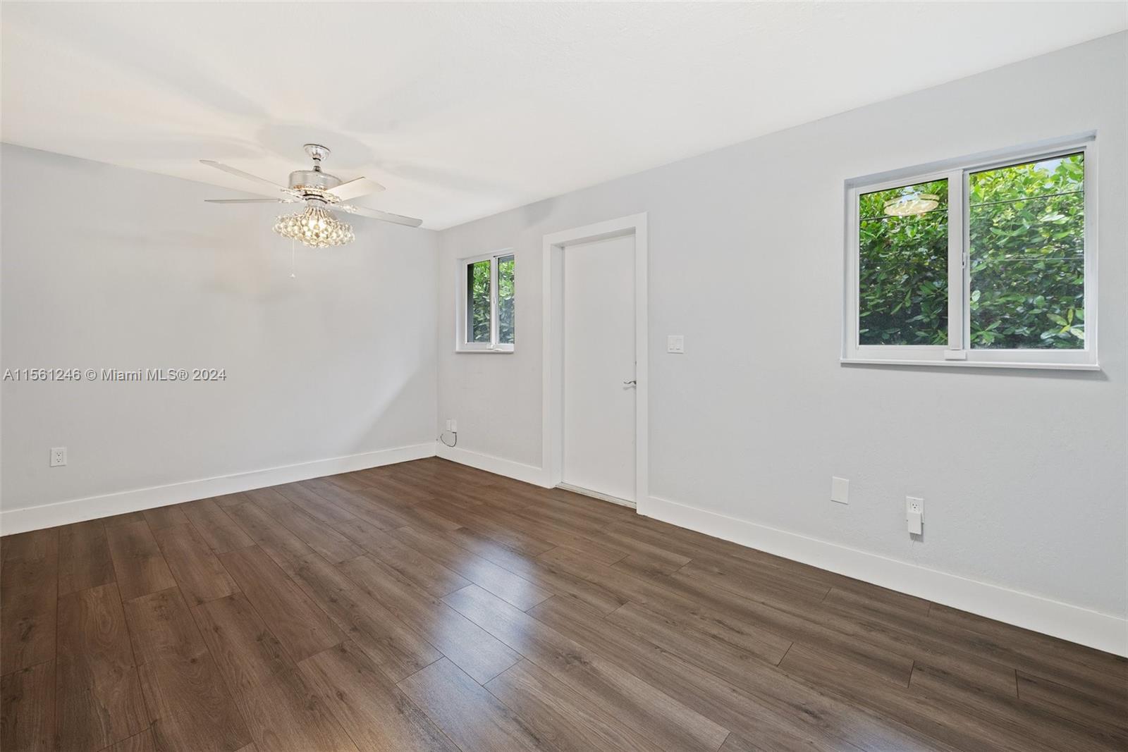 2733 Southwest 15th Street Miami, FL 33145 - Photo 16 of 34 an empty room with wooden floor and windows