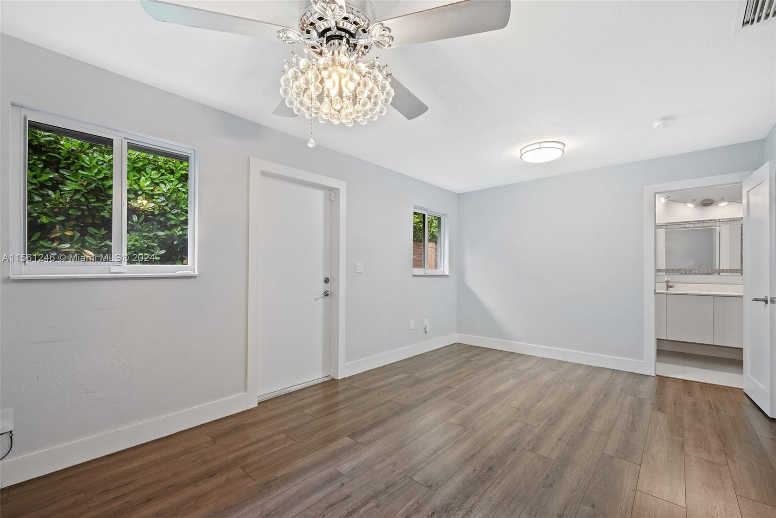 2733 Southwest 15th Street Miami, FL 33145 - Photo 18 of 34 a view of empty room with wooden floor and window