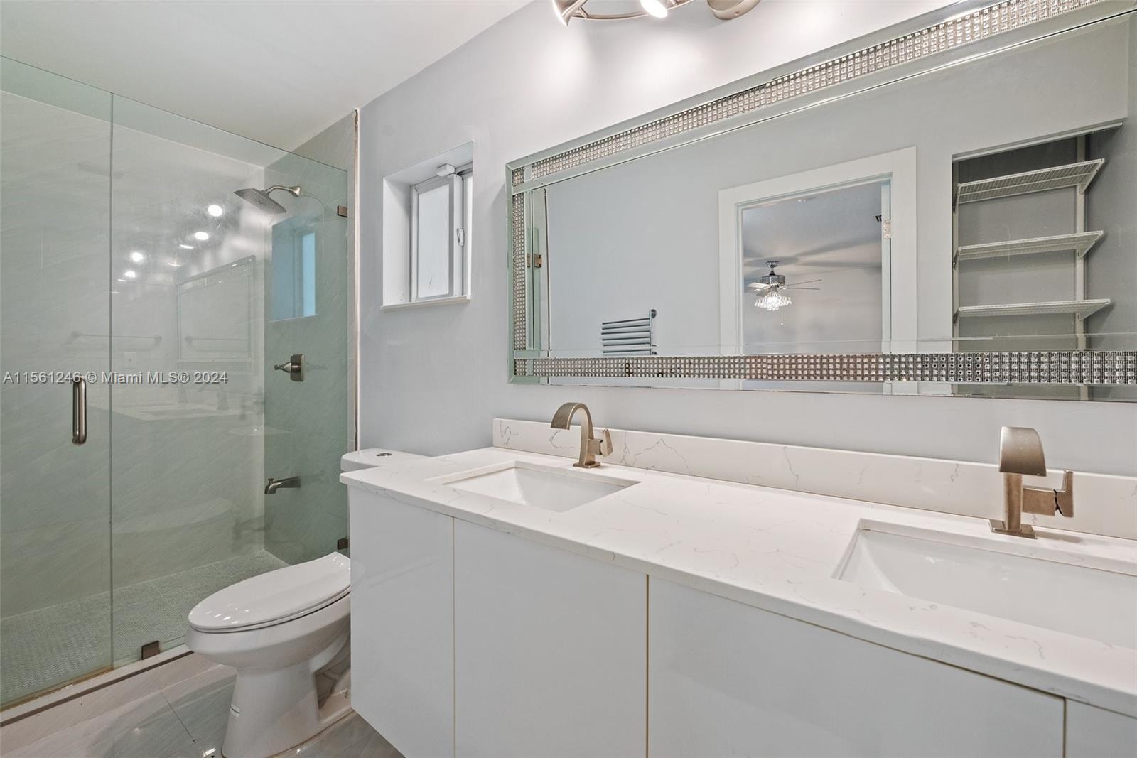 2733 Southwest 15th Street Miami, FL 33145 - Photo 19 of 34 a bathroom with a sink a toilet and shower