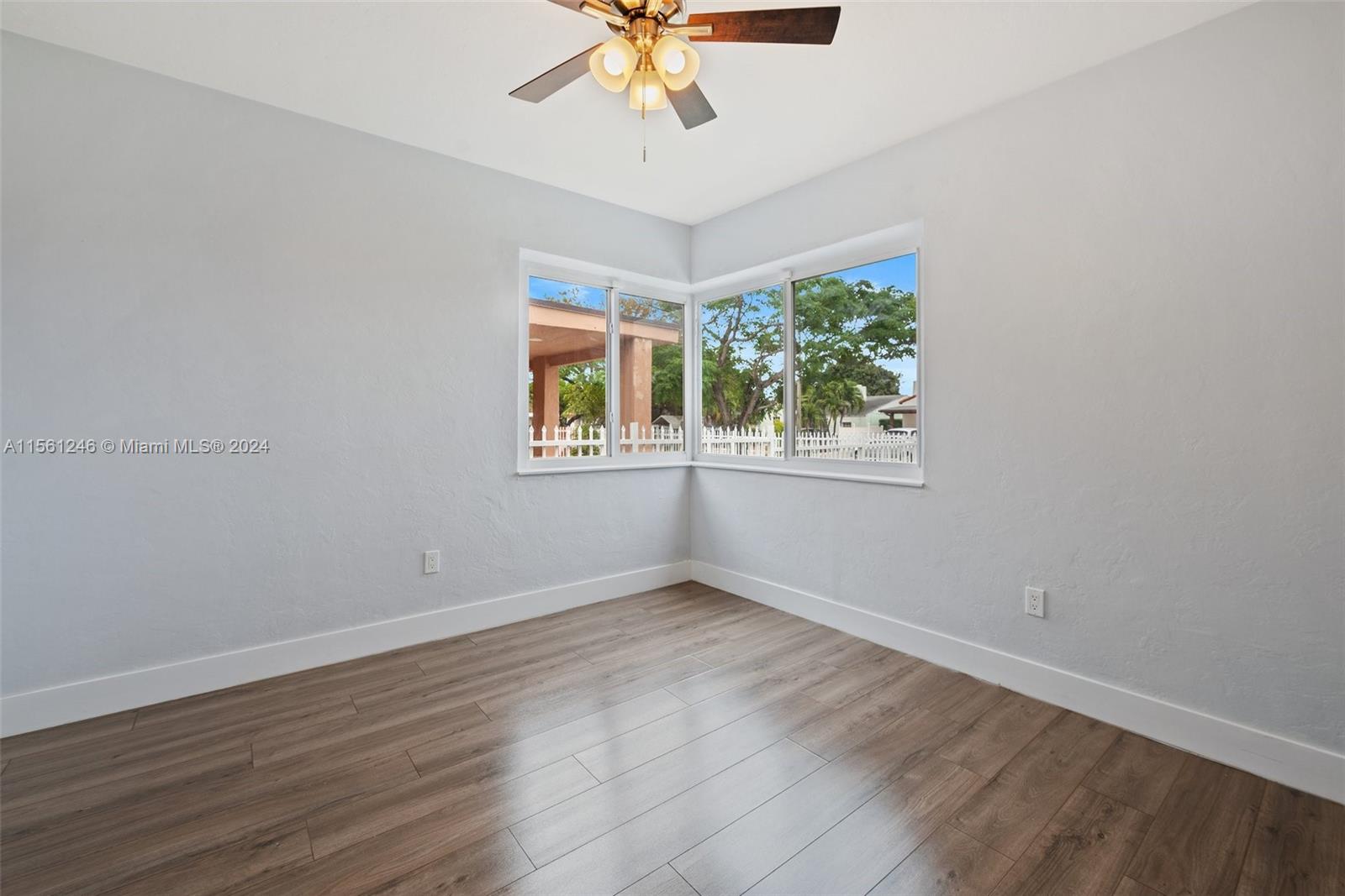 2733 Southwest 15th Street Miami, FL 33145 - Photo 21 of 34 a view of an empty room with wooden floor and a window