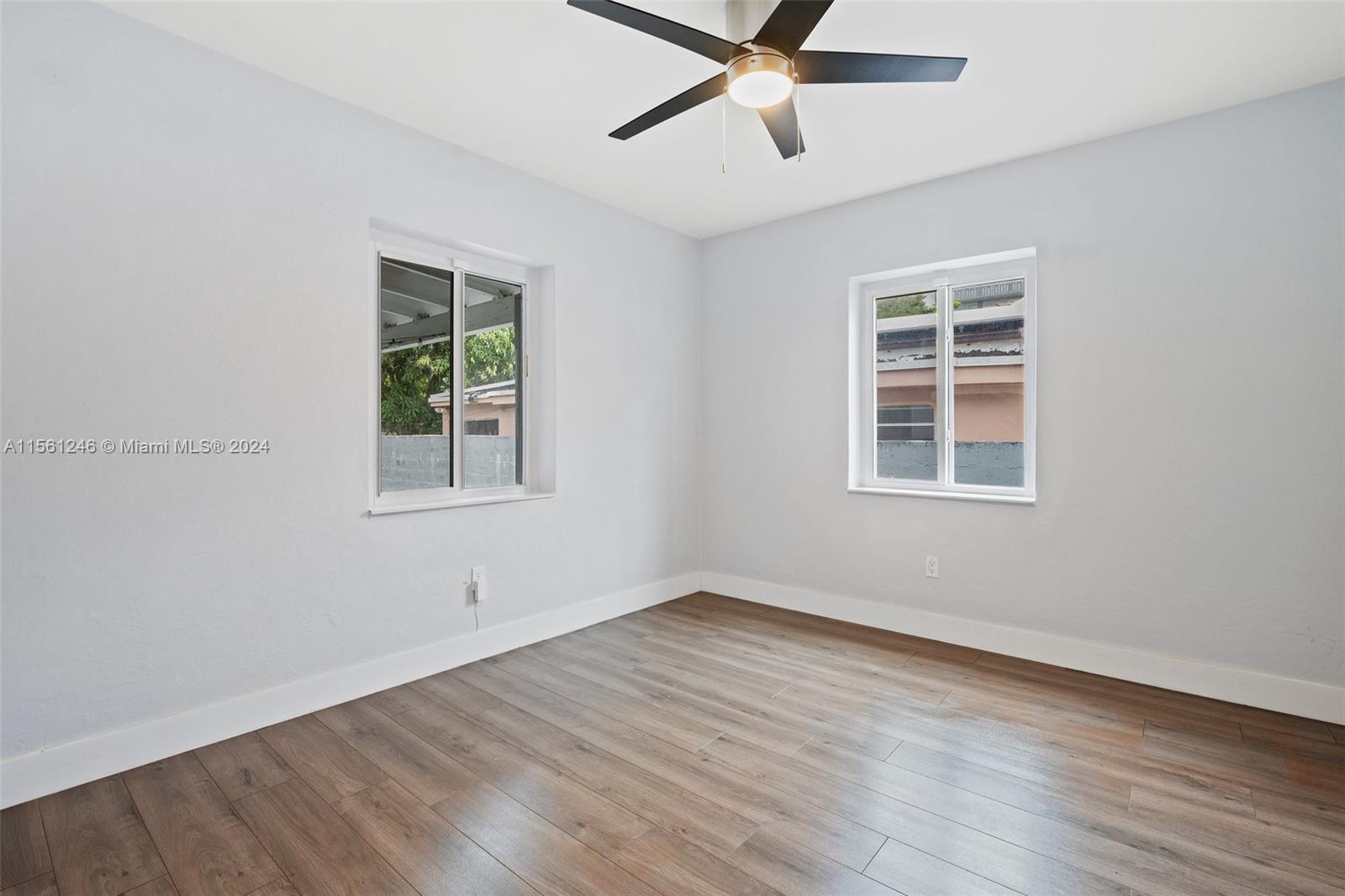 2733 Southwest 15th Street Miami, FL 33145 - Photo 24 of 34 a view of a room with wooden floor and windows