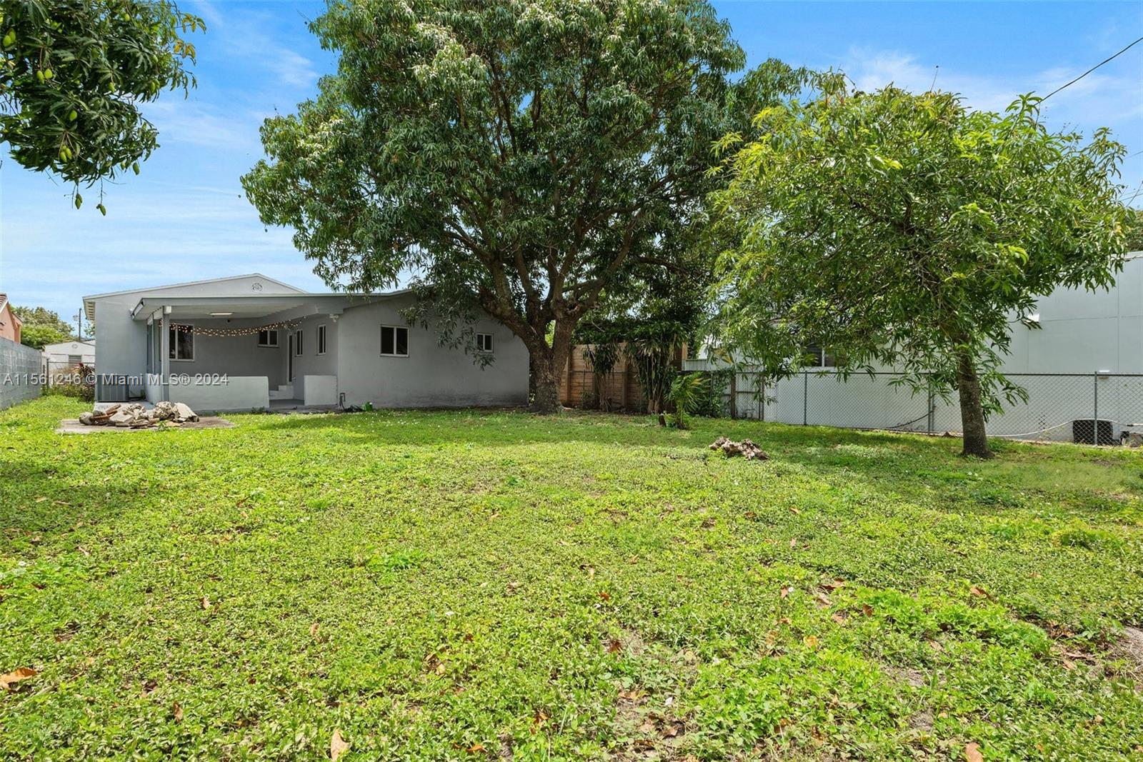 2733 Southwest 15th Street Miami, FL 33145 - Photo 28 of 34 a front view of house with yard and green space