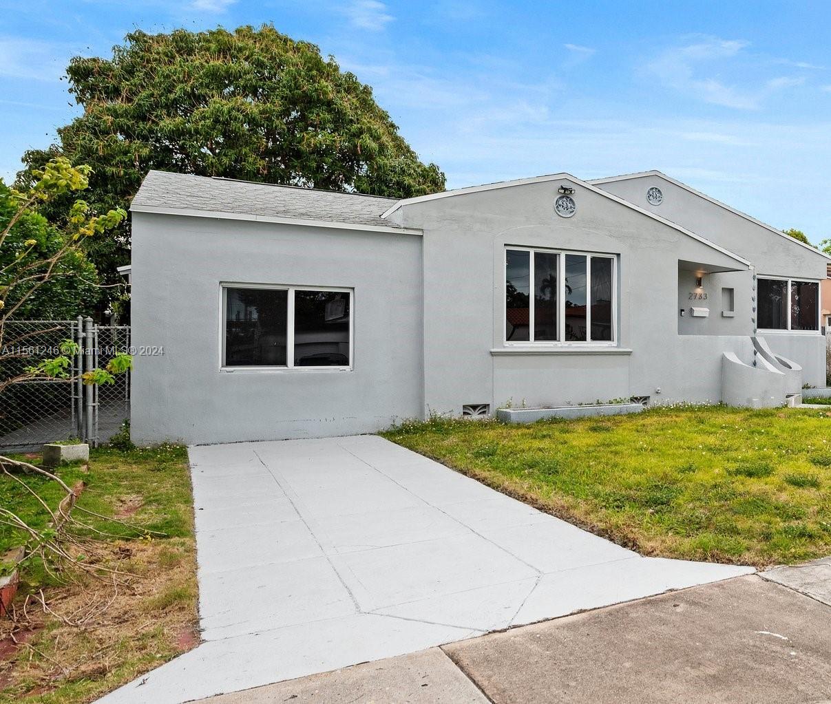 2733 Southwest 15th Street Miami, FL 33145 - Photo 3 of 34 a front view of a house with garden