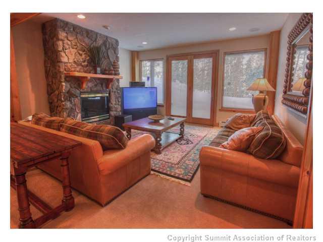 6 Rounds Road Breckenridge, CO 80424 - Photo 11 of 25 a living room with furniture a large window and a fireplace